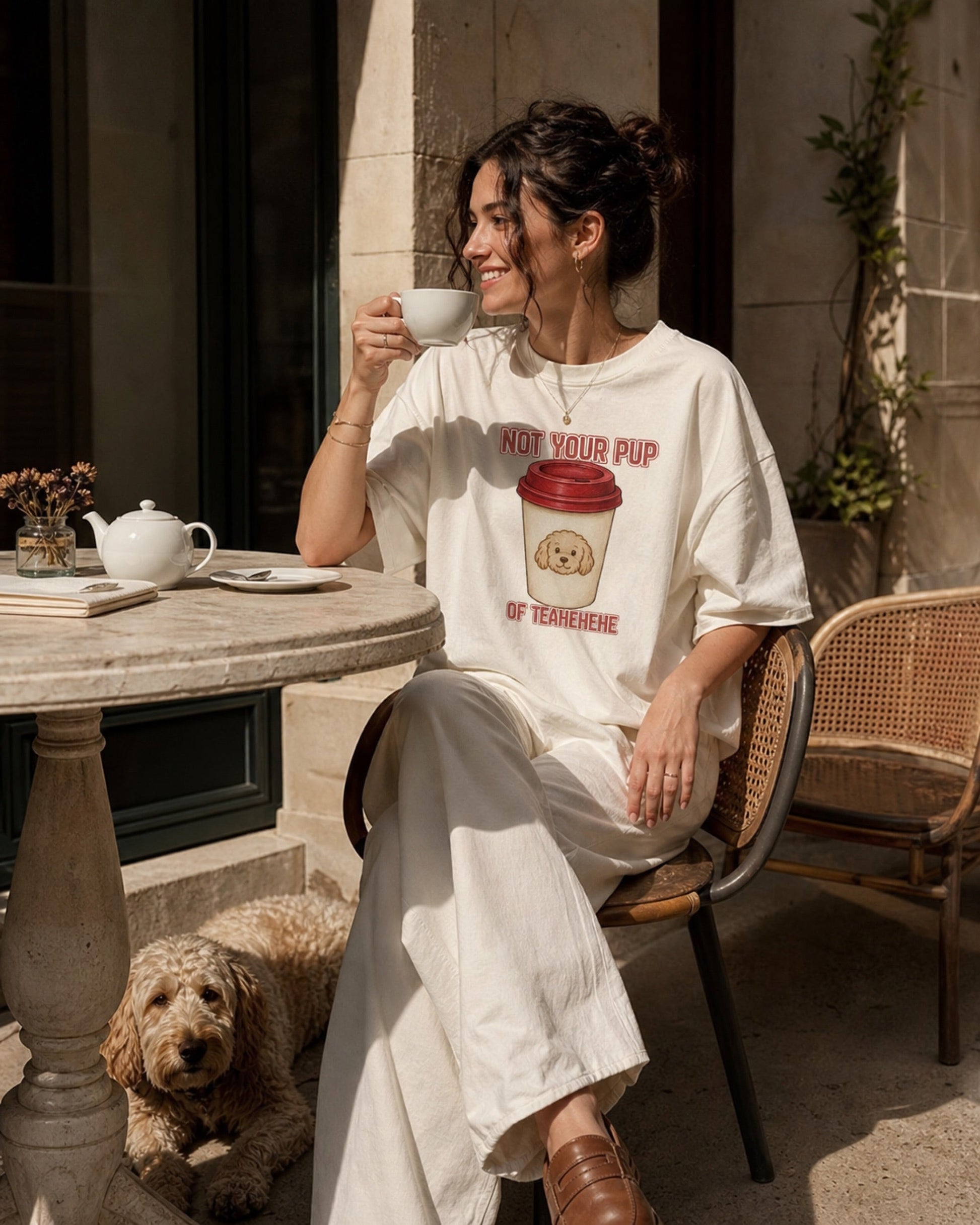 Not Your Pup Of Tea tee worn in a cafe